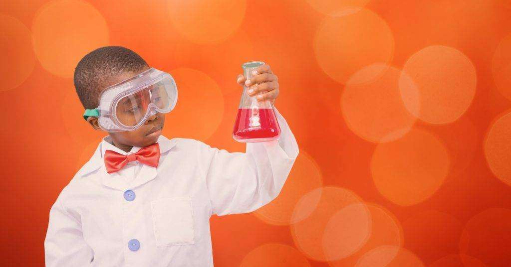 Digital composite of Little boy experimenting over blur background