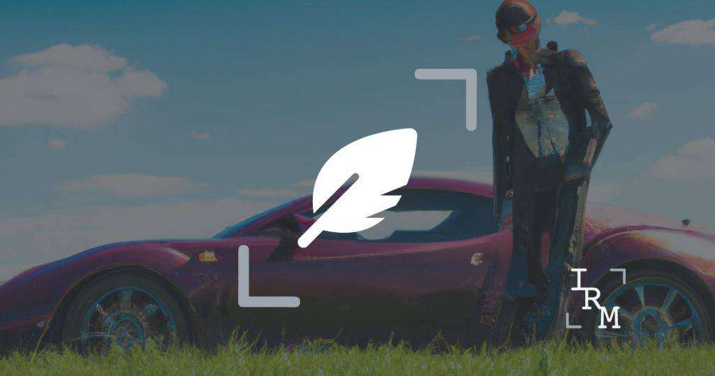 Man in business suit standing in front of bugatti with an overlay of a quill representing poetry with IRM logo in bottom right
