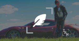 Man in business suit standing in front of bugatti with an overlay of a quill representing poetry with IRM logo in bottom right